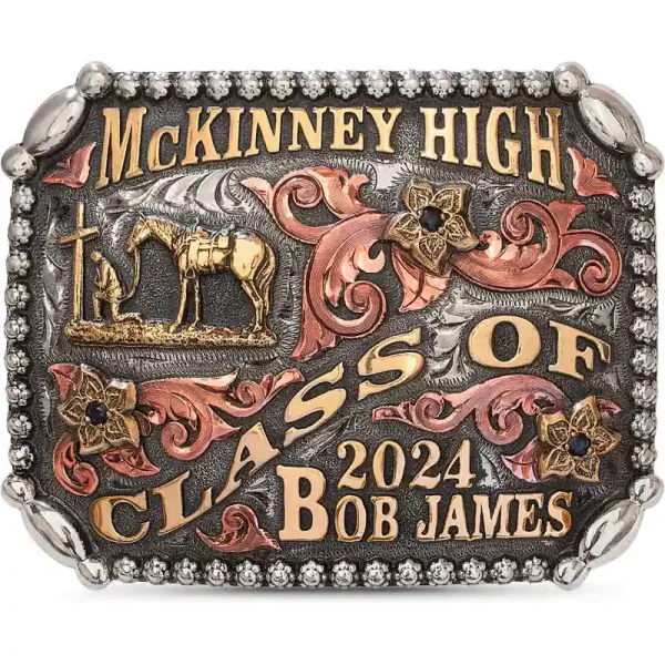 Celebrate in style with the McKinney Belt Buckle, featuring a German Silver base with oblong bead corners and a berry edge, copper scrolls and unique lettering. Choose your stone color and figure to make it uniquely yours.